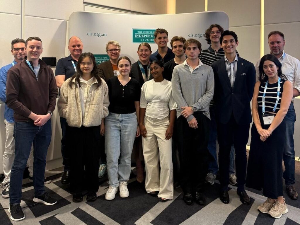 Group of 16 people posing for professional photo at The Centre for Independent Studies event